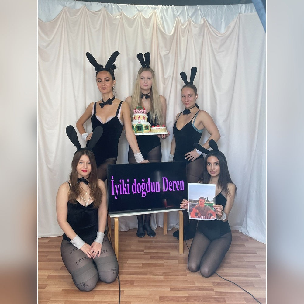 Ukrainian girls in black bunny outfits creating a personalized birthday video